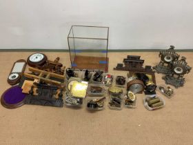 A quantity of wall and mantel clock parts for spares and repairs