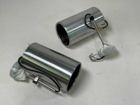 A pair of polished steel adjustable spotlights.