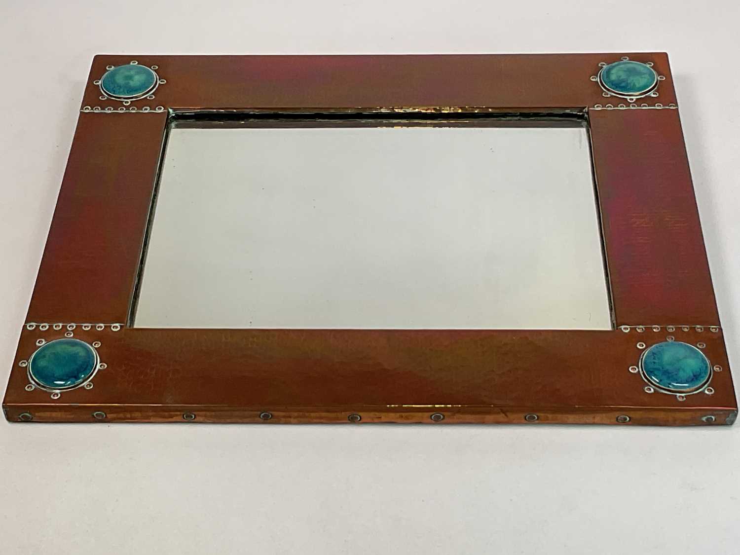 LIBERTY; an Arts and Crafts hammered copper rectangular wall mirror set with four Ruskin type - Image 3 of 7