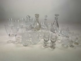 A quantity of glasses and decanters including four Waterford cut glass tankards, a set of six