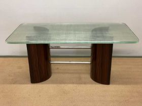 A mid 20th century Danish zebra wood and glass topped coffee table, with semi circular upright