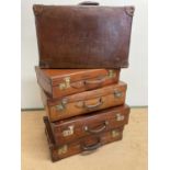 Five 20th century leather suitcases, largest 66 x 41 x 20cm.