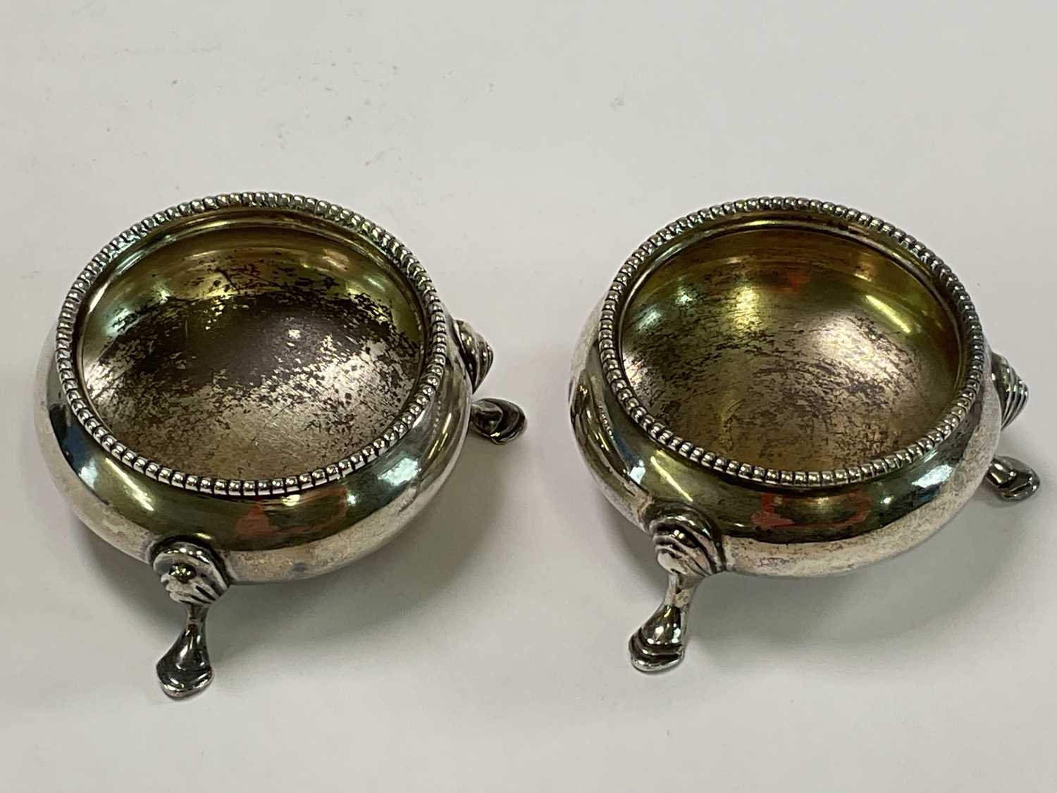 ROBERT HENNELL; a pair of Victorian hallmarked silver open salts raised on three scrolling supports, - Image 4 of 4