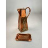 An Arts and Crafts copper water jug with tapered body embossed with stylized plants, height 28cm,