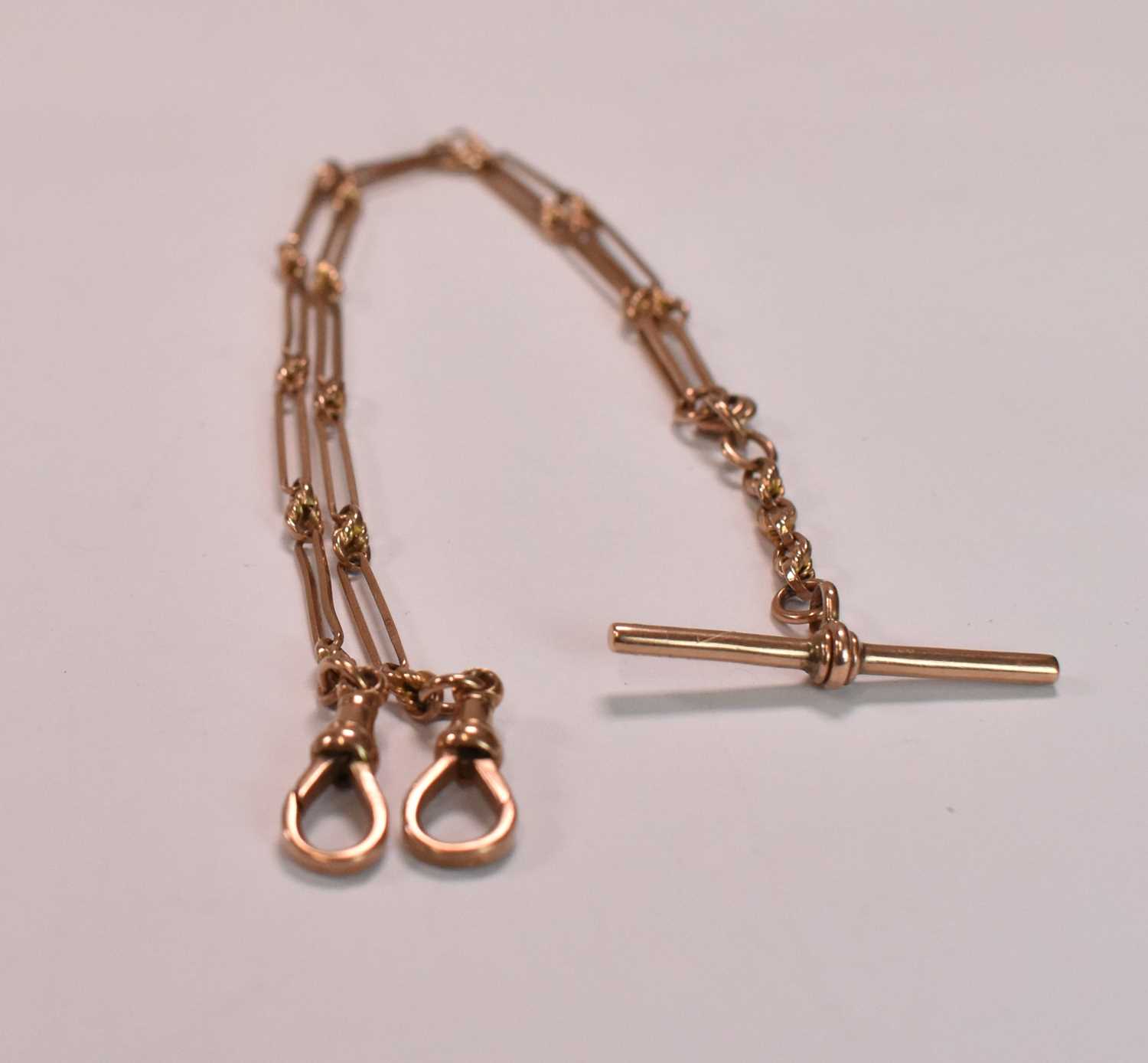 A 9ct rose gold Albert chain with T-bar and sprung end clasp, length 38cm. 12.2g approx Condition - Image 2 of 2