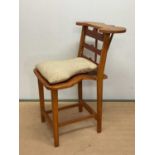 A reproduction voyeur's chair, height 104cm, width 61cm, depth 72cm.