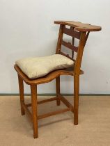 A reproduction voyeur's chair, height 104cm, width 61cm, depth 72cm.