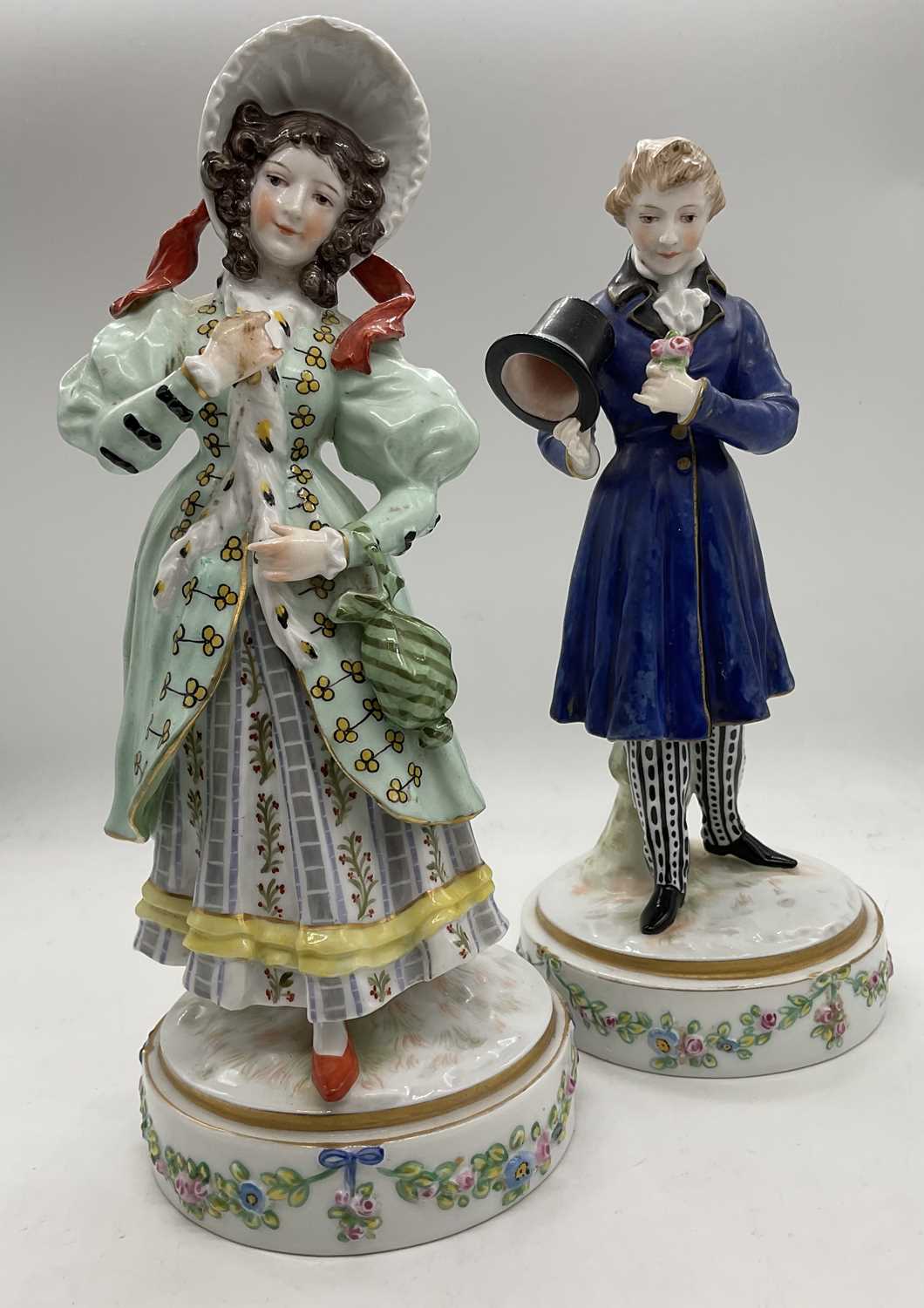 KARL ENS; a porcelain figure of a young woman wearing elaborate clothing and a bonnet, painted and