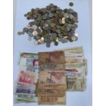 A quantity of world coins and bank notes.