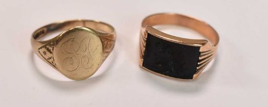 A 9ct yellow gold signet ring with traces of engraved initials, size U, and a yellow metal ring with
