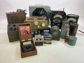 A quantity of vintage batteries, avometer and other items