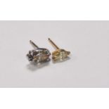 Two diamond ear studs, both set with marquise cut stones, one weighing approx 0.50ct, one weighing