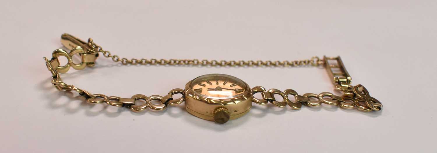 A lady's vintage 9ct yellow gold wristwatch with gold bracelet and baton markers to the oval dial, - Image 3 of 4