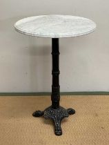 A marble topped table with metal base, height 71cm, width 49cm.