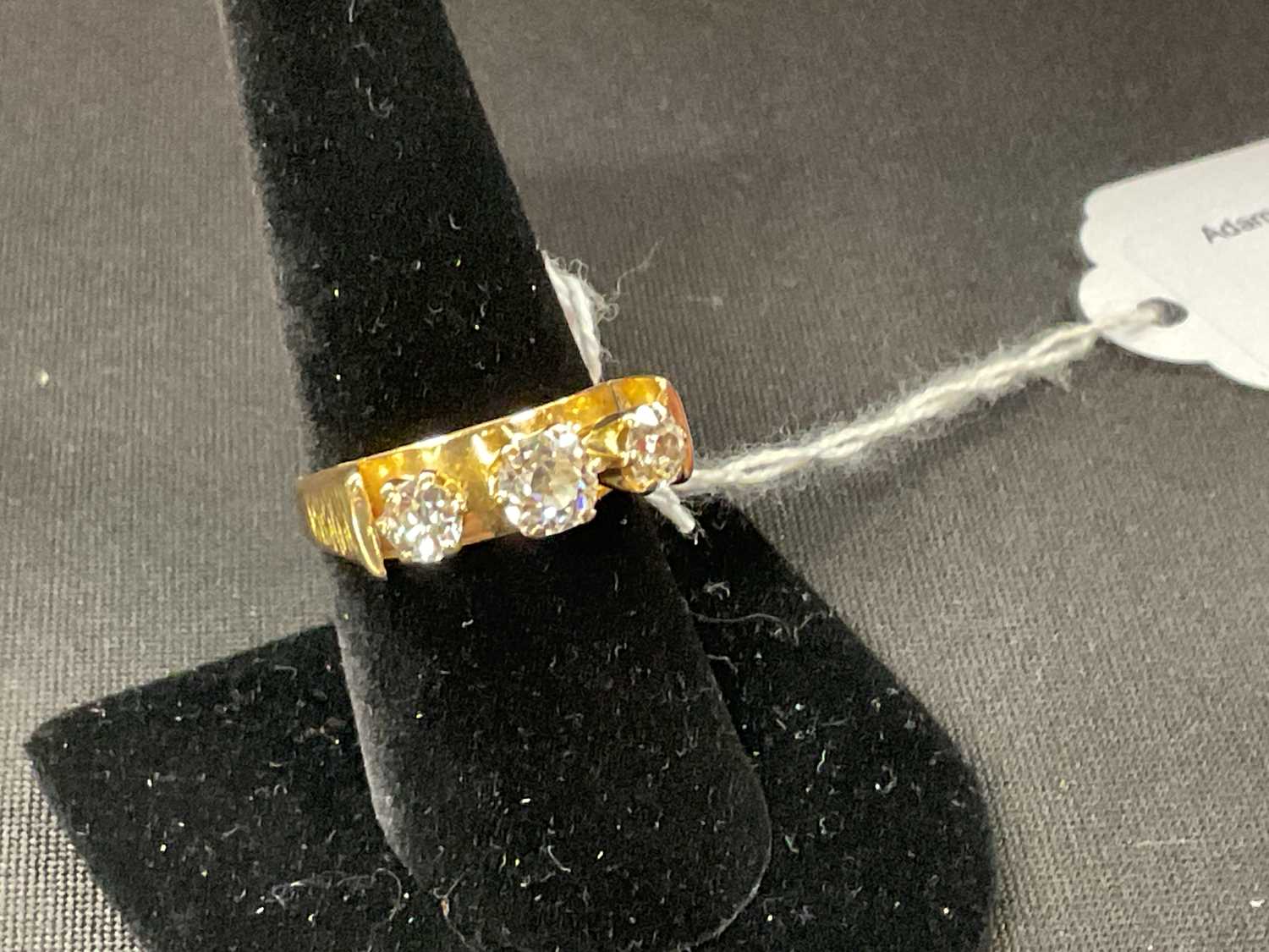 An 18ct yellow gold three stone diamond ring with unusual raised setting formed of three old - Bild 4 aus 6