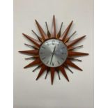 METAMEC; a sunburst clock, diameter 18cm