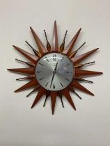 METAMEC; a sunburst clock, diameter 18cm