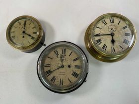 Three brass cased wall clocks, all with dials set with Roman numerals, one marked JW Ray, Liverpool,