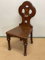 A mahogany hall chair with carved detail, height 96cm