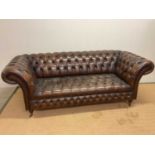 A mid 20th century brown leather button back Chesterfield sofa, height 80cm, width 220cm, depth