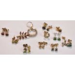 A group of 9ct mainly yellow but also white gold single studs, also a small brooch.