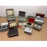 A collection of reel to reel equipment, by manufacturers Phillips, Grundig etc, with some reels of