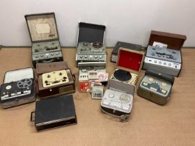 A collection of reel to reel equipment, by manufacturers Phillips, Grundig etc, with some reels of