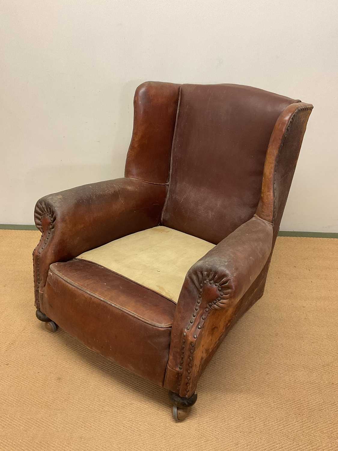 An early 20th century leather armchair with studded arms and side panels, height at back 84cm, width - Image 2 of 3