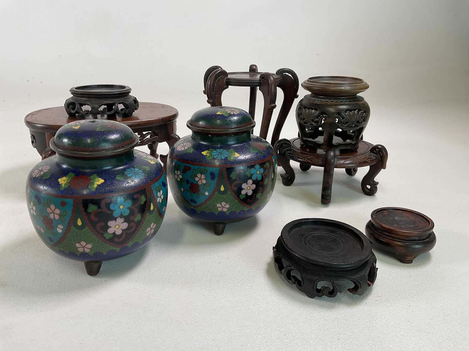 A pair of squat cloisonné jars and covers (lacking finials), height 12cm, and a small group of