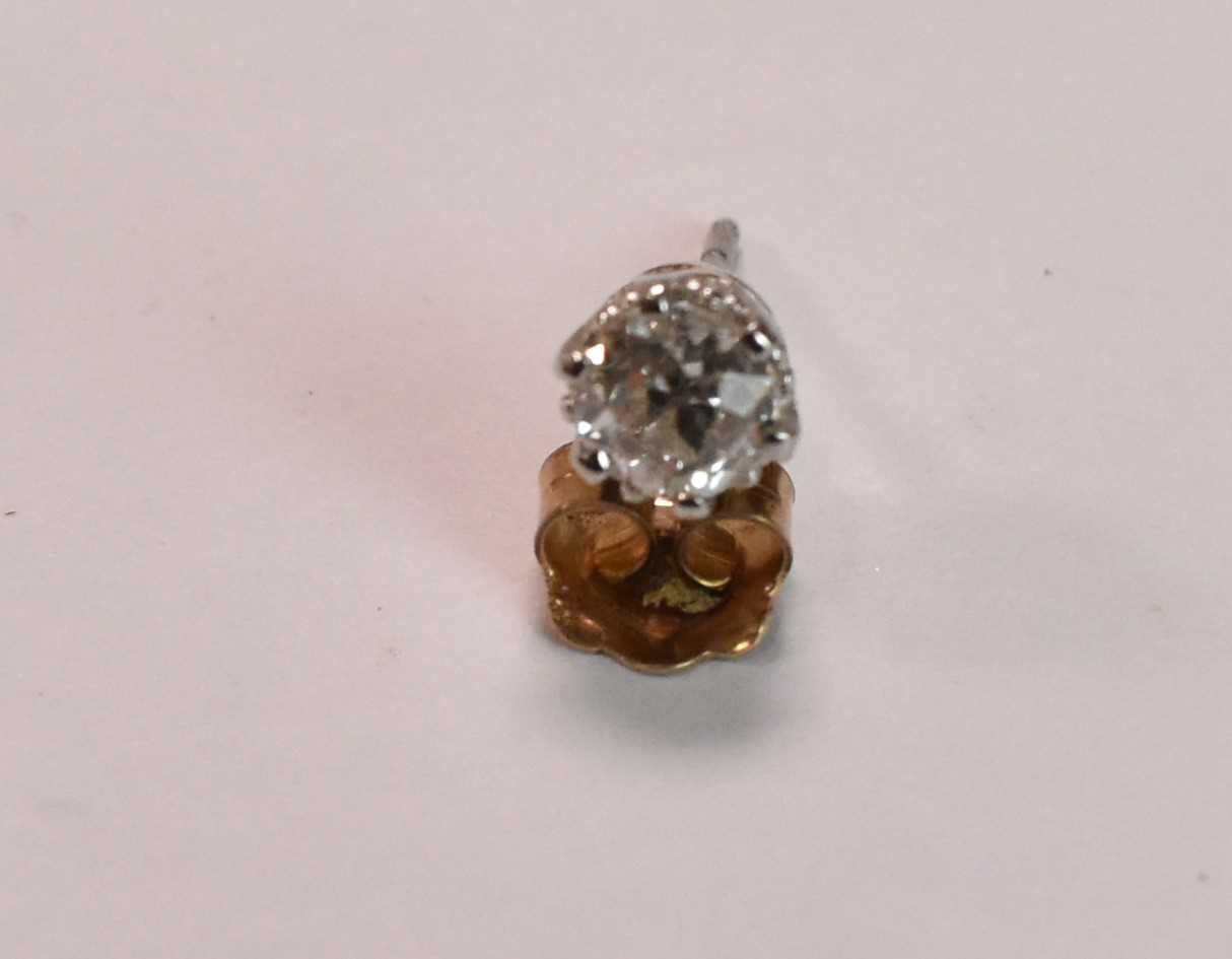 A yellow metal single diamond ear stud, the old round cut stone weighing approx 0.50ct, in six - Image 2 of 2