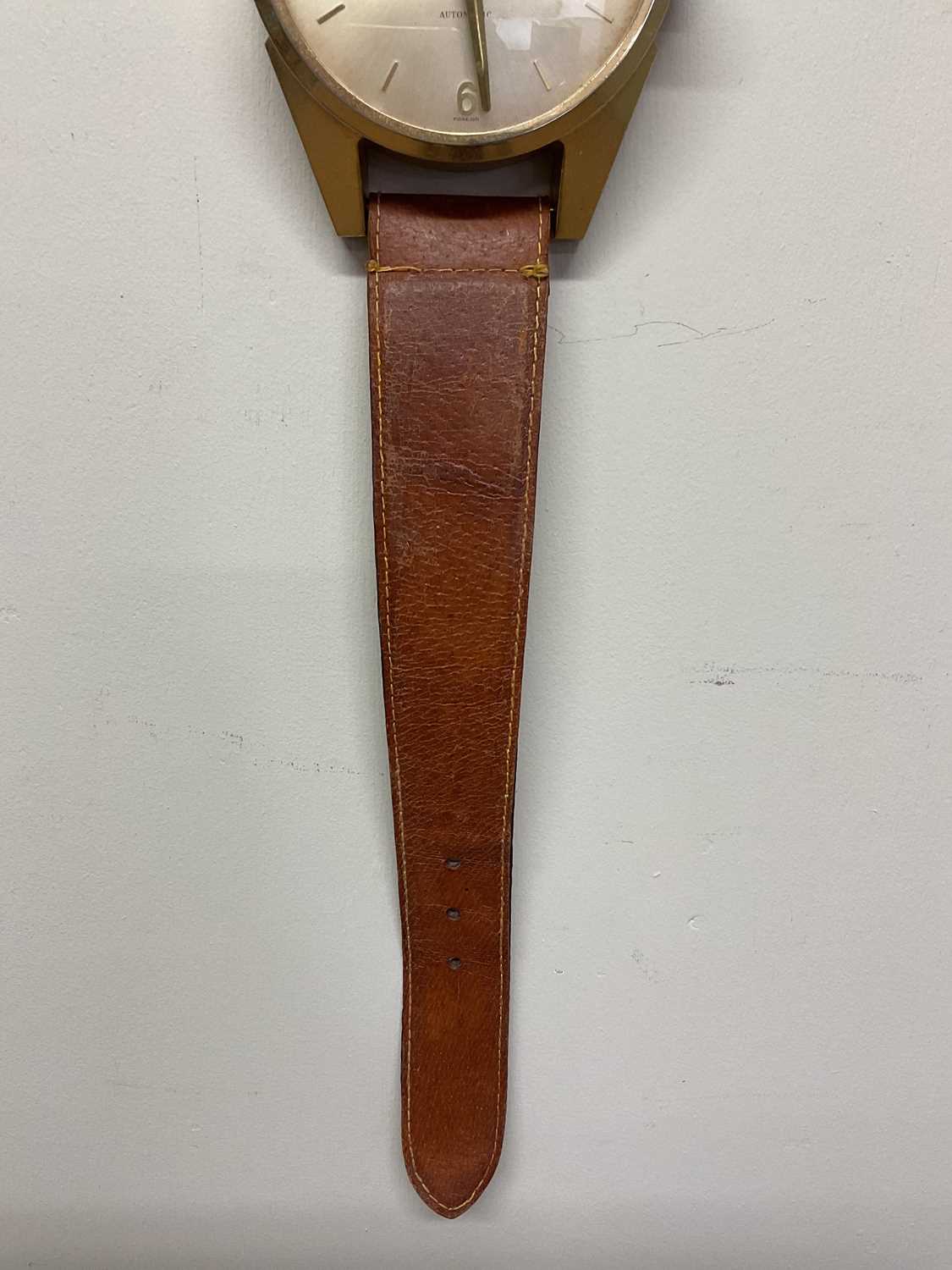 ESTYMA; a wall clock styled as a wristwatch on leather strap, height 78cm, width 12cm - Image 3 of 5
