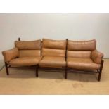 ARNE NORELL; a mid 20th century Swedish leather Kontiki three seat sofa, height at the back 76cm,