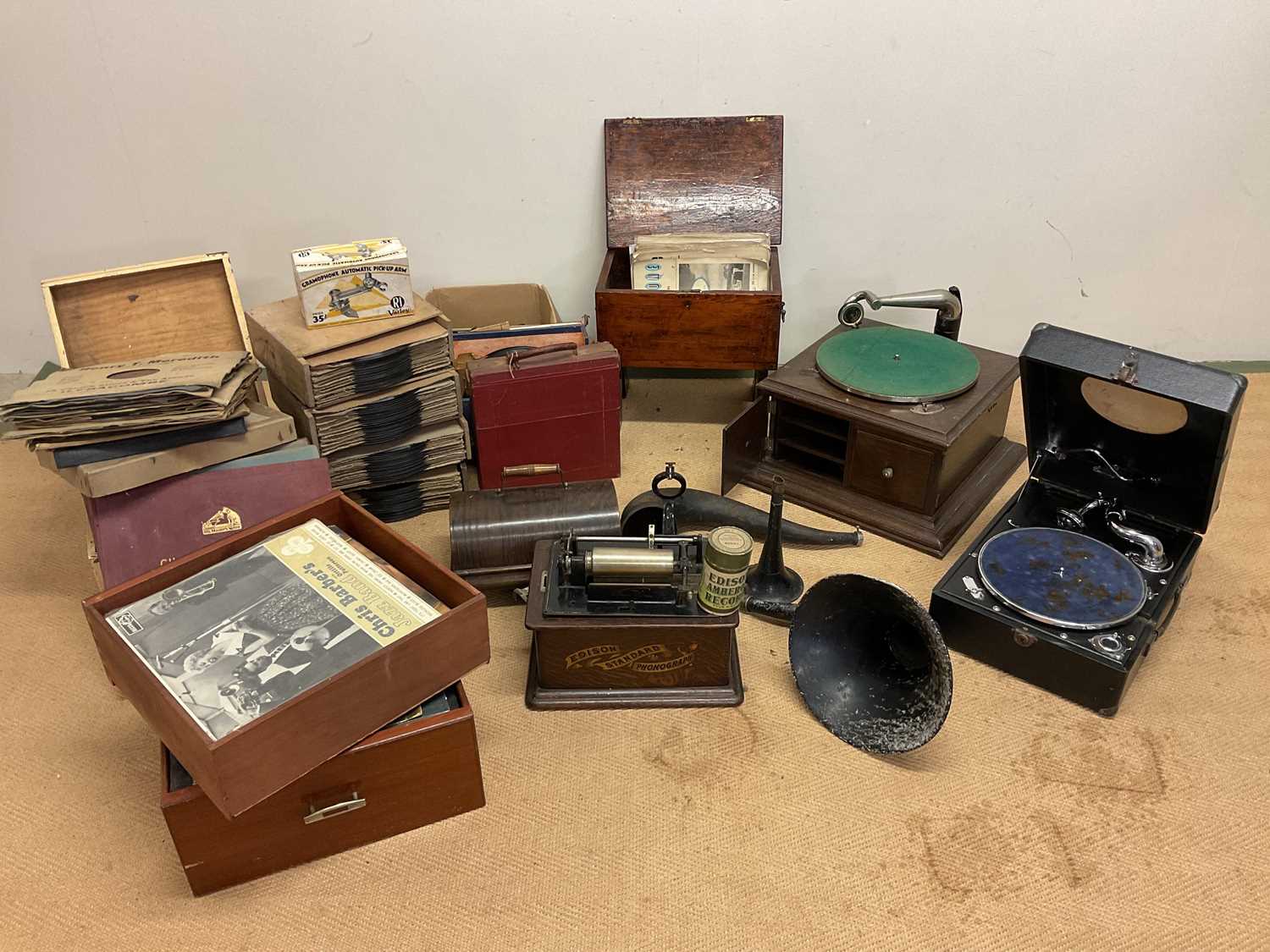 An Edison Standard phonograph, two gramophones, assorted horns, and a large collection of 78 records