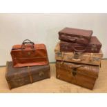 A tin domed trunk, a slat bound trunk, a case and two smaller cases (5).