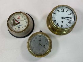 Three brass ship's clocks including a Russian naval submarine clock circa 1960, diameter 17cm