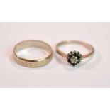 An 18ct yellow gold floral dress ring, size N 1/2, and an 18ct gold wedding band, size O, combined