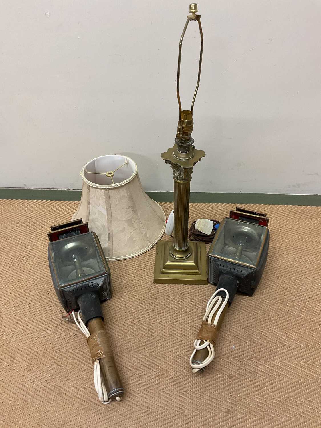 A brass table lamp and two converted carriage lamps, table lamp height 45cm.