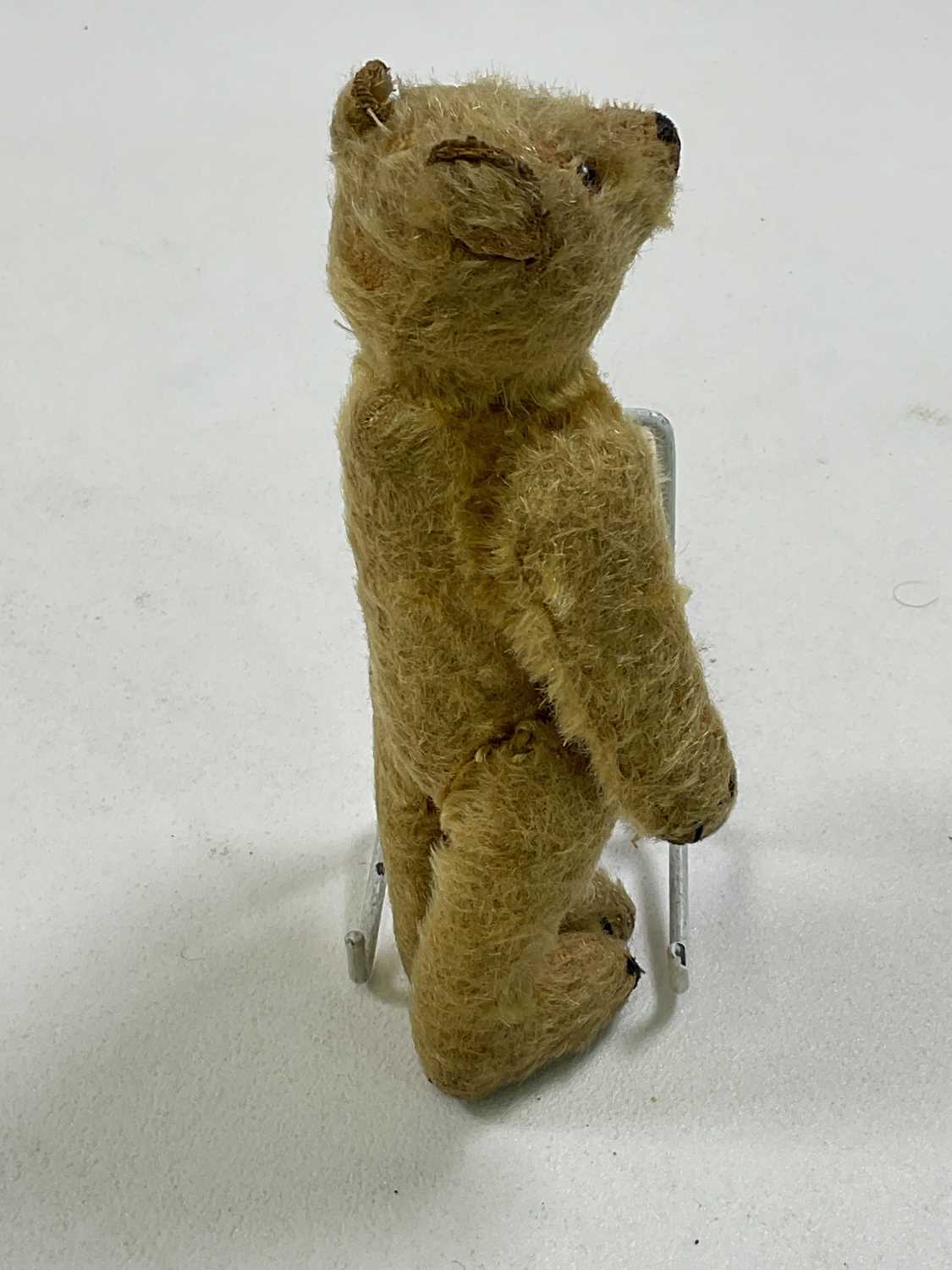 A small vintage mohair Teddy bear with glass eyes and a hump back, stitched nose, paws and feet, - Image 5 of 6