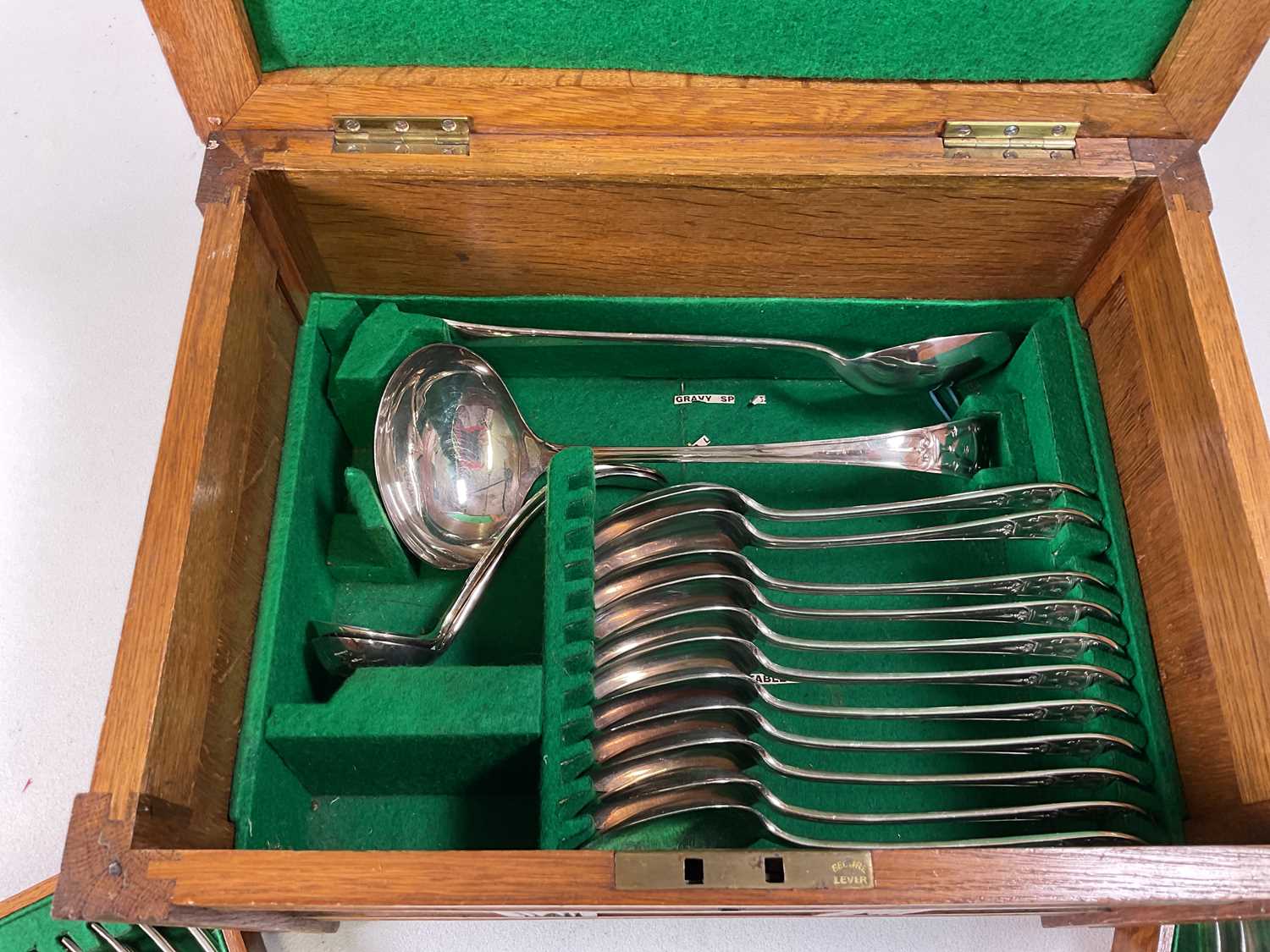 An oak cased canteen of silver plated cutlery, the case unusually modelled as a coffer. - Image 4 of 5