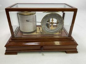An early 20th century mahogany barograph with drawer to base and silvered upright circular dial,
