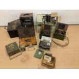 A group of items of military interest including ammo boxes, gas masks, field telephones, morse