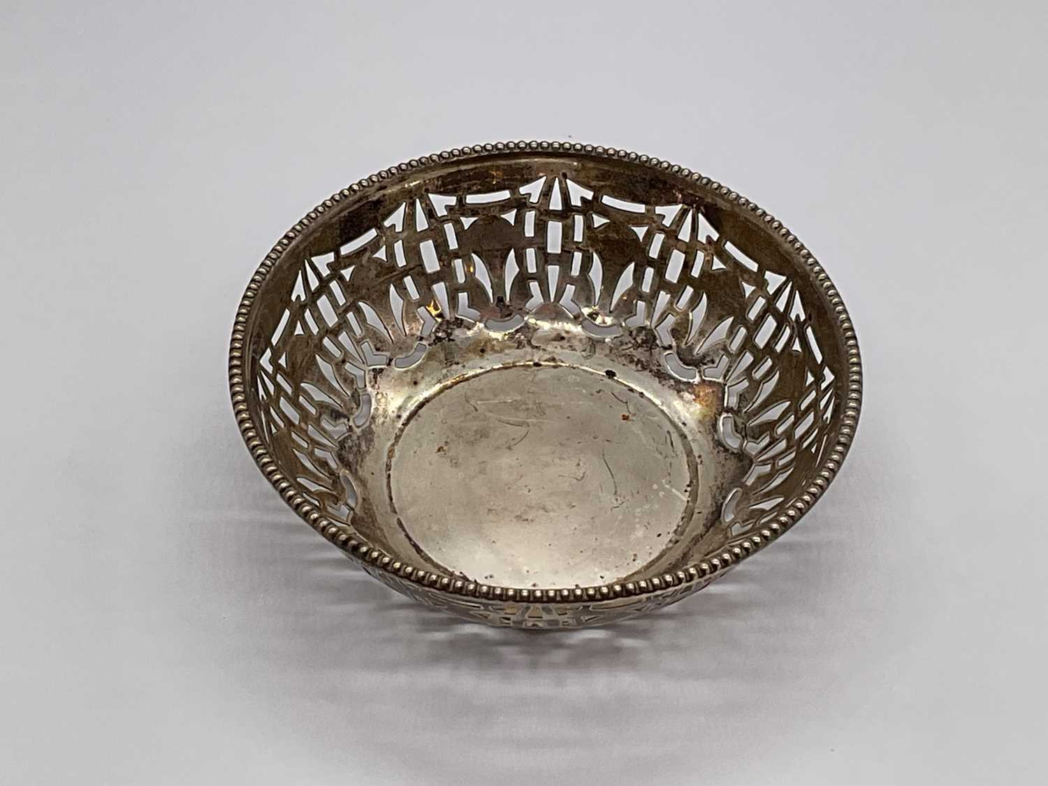 GEORGE HOWSON; an Edward VII hallmarked silver dish with pierced decoration, London 1902, approx