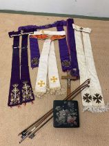 A collectors' lot comprising a quantity of embroidered vestments (af), three violin bows, a crucifix