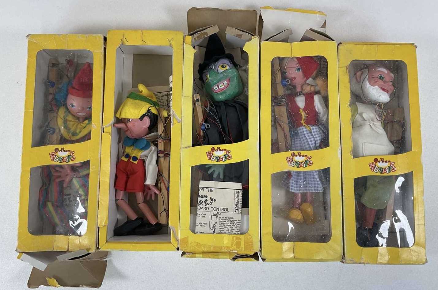 PELHAM PUPPETS; to include Gepetto, Pinocchio, Witch, Clown and Dutch Girl, all with boxes (5)