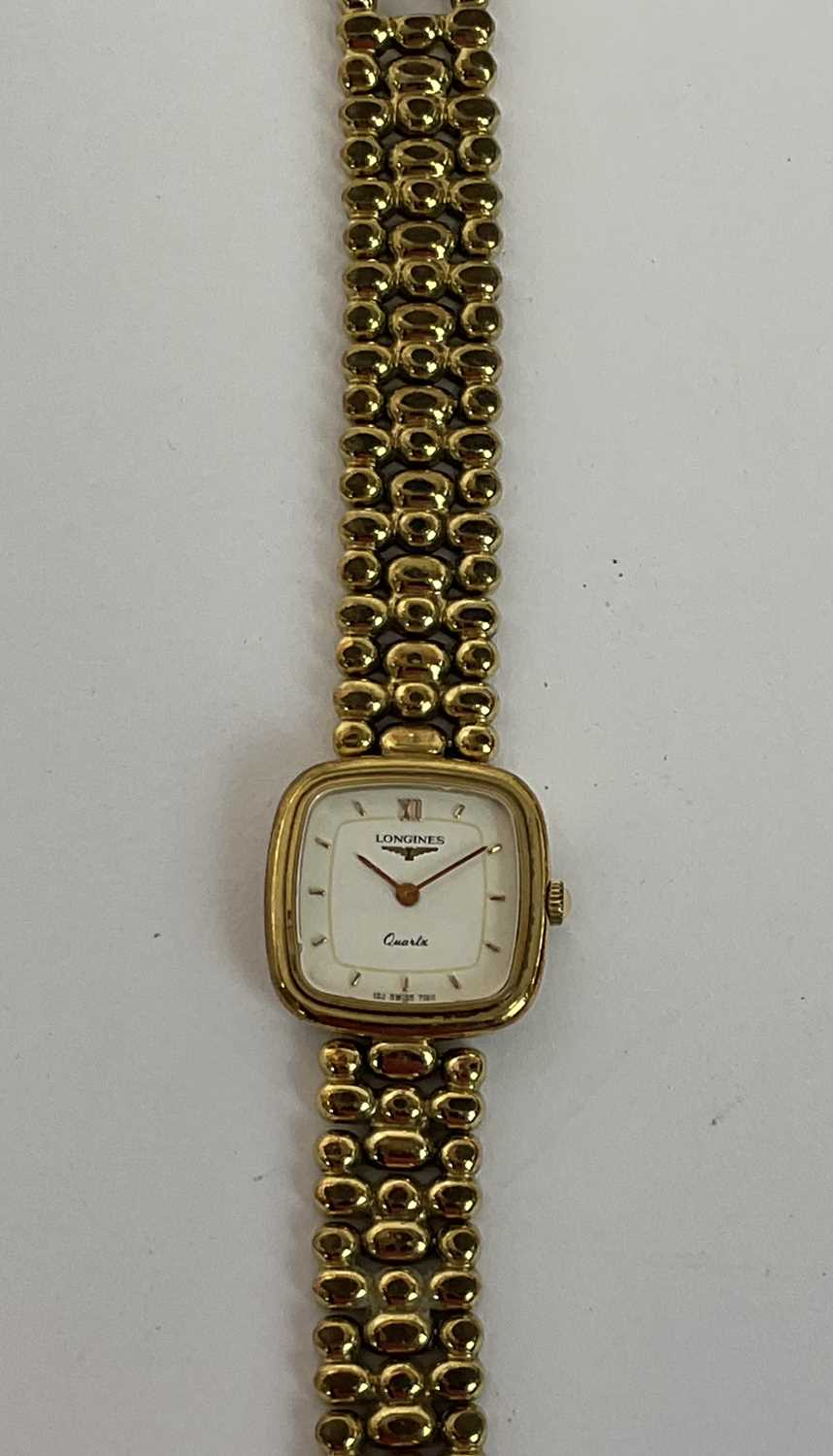 LONGINES; a lady's gold plated quartz wristwatch with baton markers to the dial, with card and - Image 3 of 4