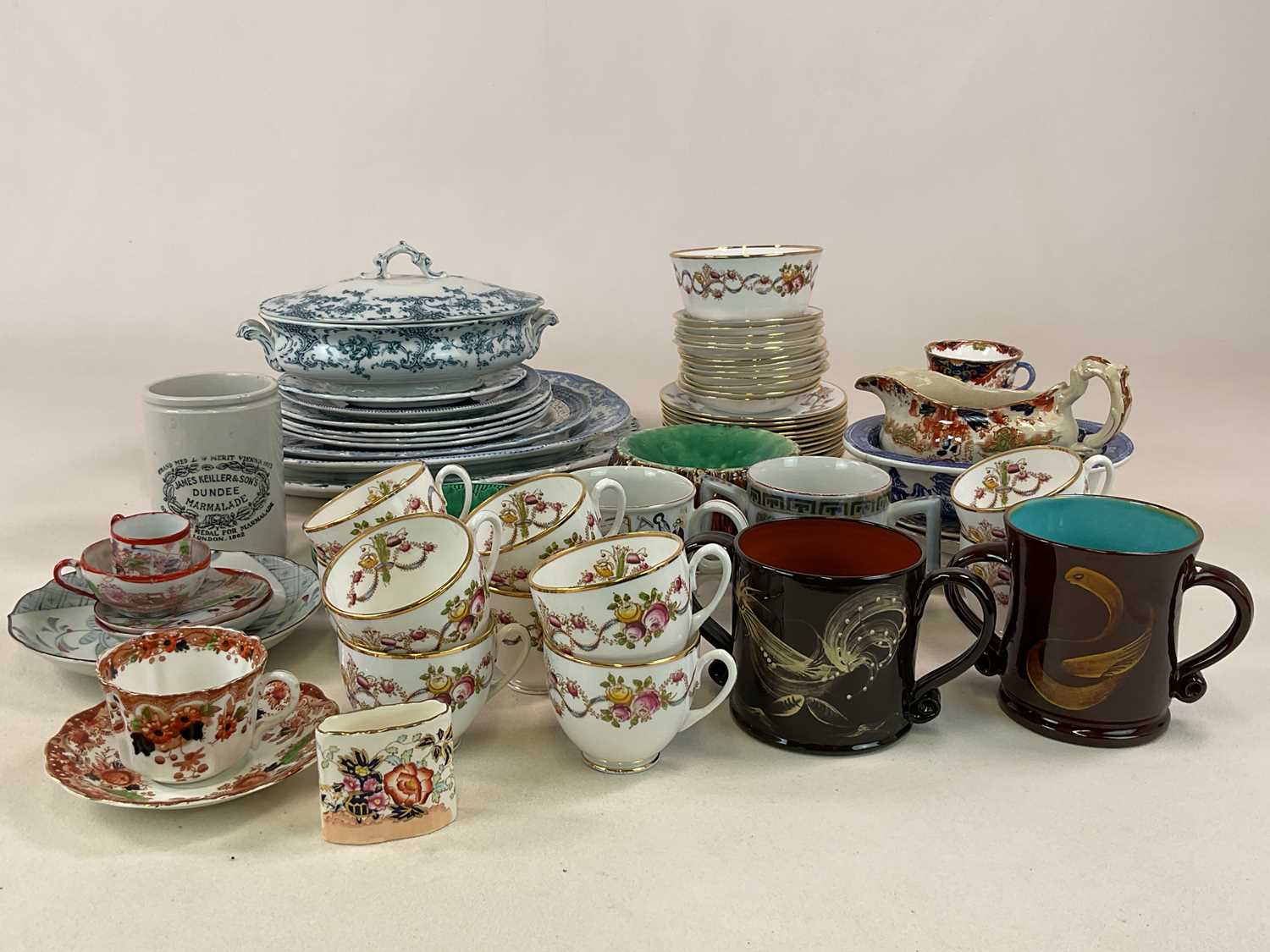 A quantity of ceramics including blue and white transfer wares, tea wares, loving cups and other