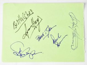 A torn page from an autograph book bearing the signatures of Isaac Hayes, Booker T, Donald 'Duck'