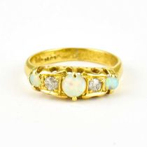 An 18ct gold diamond and opal ring, size O, approx. 3.7g.