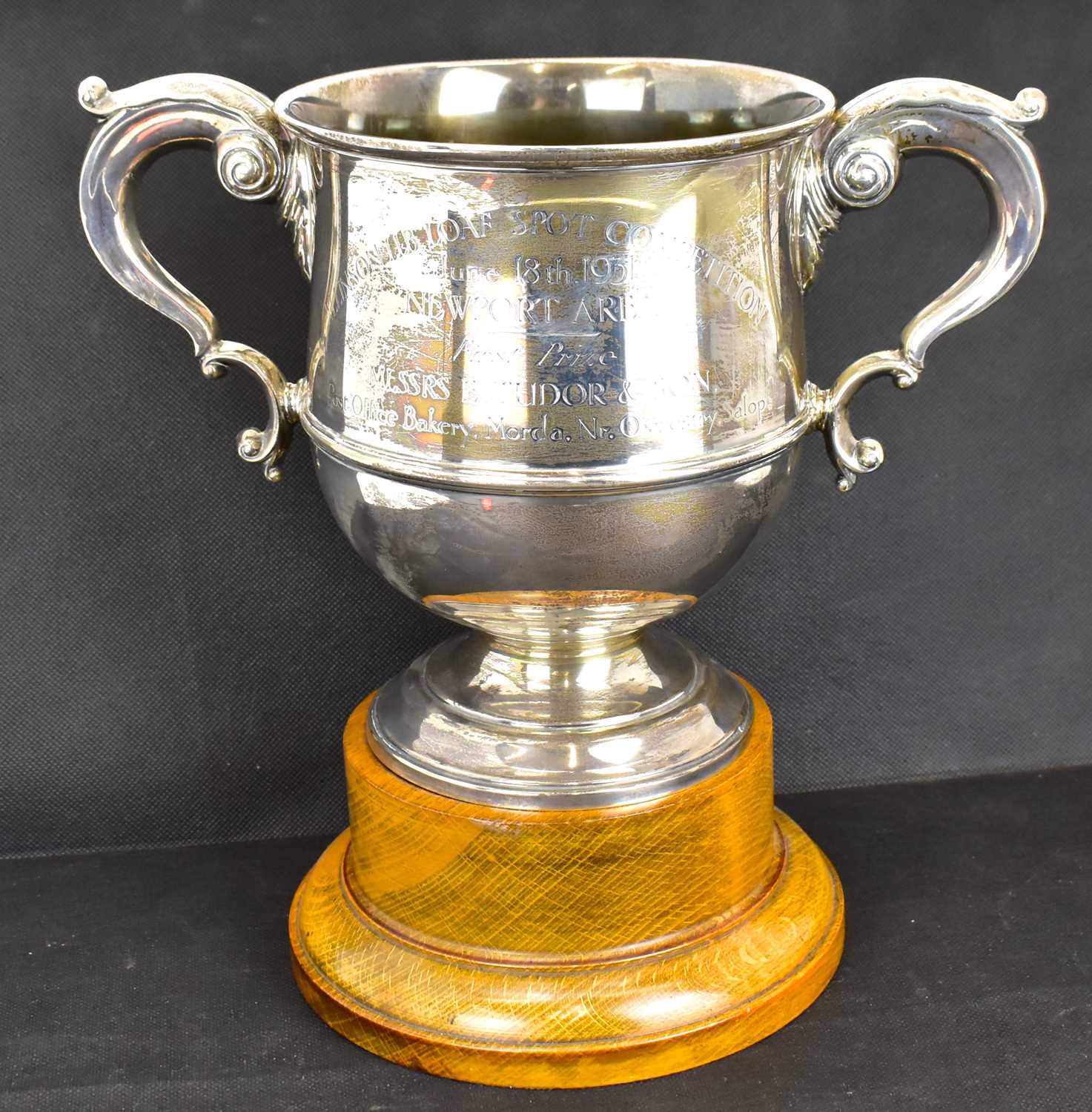 A George V hallmarked silver large twin-handled trophy cup, engraved 'Allinson 1lb Loaf Spot
