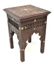 An Indian carved side table with inlaid mother of pearl star shape decoration and bobbin turned